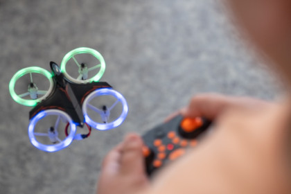 A participant of the DroneMasters Academy vacation course in Hamburg controls a small drone